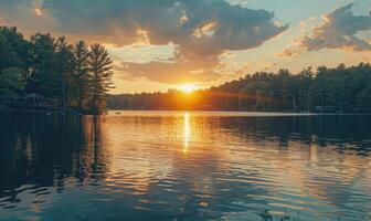 A summer sunset casting warm hues over the peaceful lake photo