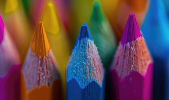 Close-up of sharpened colored pencils in a holder photo