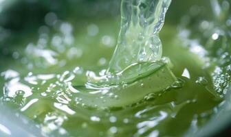 Close-up of aloe vera gel being extracted and blended with botanical oils and essences photo