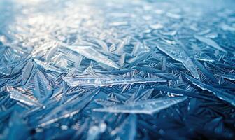 Close-up of icy patterns forming on the surface of a frozen lake photo