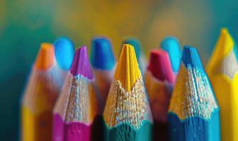Close-up of sharpened colored pencils in a holder photo