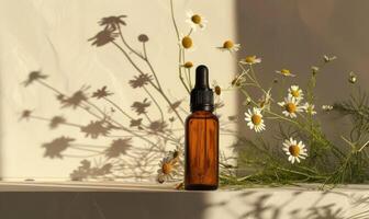 Chamomile essential oil in a dropper bottle, closeup view, skin care cosmetic mockup photo