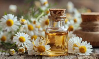 Chamomile essential oil in a dropper bottle, closeup view, skin care cosmetic background photo