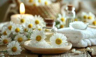 Chamomile essential oil in a dropper bottle, closeup view, skin care cosmetic background photo