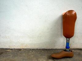 Prosthetic legs against the wall photo