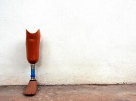 Prosthetic legs against the wall photo