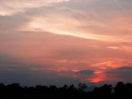 orange at sunset, beautiful with clouds photo