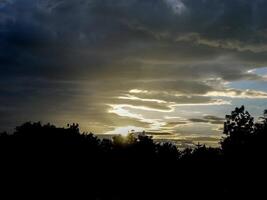 Spectacular sunset over, orange sun rising up over the horizon photo