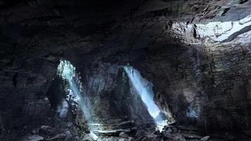 A cave filled with lots of rocks and water video