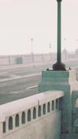 An empty illuminated asphalt road in a thick fog video