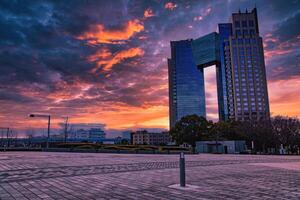 A dusk of cloud reflecting an impressive building cloudy wide shot photo