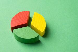 Colorful wooden pie chart pieces photo