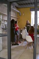 female office staff having a coffee break in the office kitchen photo