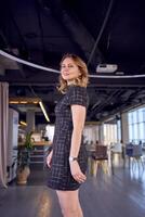 stunning model in business mini dress catwalk in modern office space photo