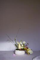 Easter flower arrangement with a ceramic rabbit in a minimalist style photo