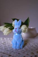 minimalistic tulips on a table with an easter bunny photo