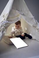 book mockup      toddler playing in a tent in a minimalist style photo