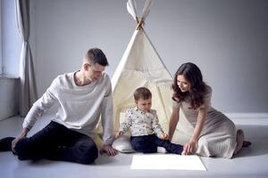 book mockup parents reading a children's book to their little son in a minimalistic style photo