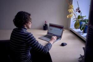 woman with laptop work in office photo