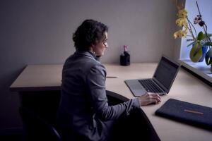 woman with laptop work in office photo