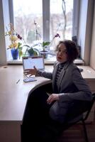 woman with laptop work in office photo