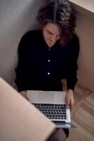 woman work with laptop on the floor photo