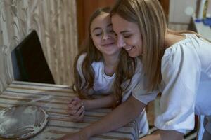 Family cooks croissants in the kitchen photo