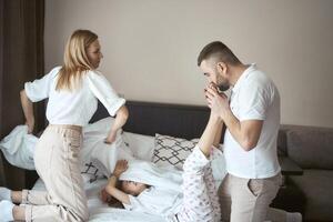 parents play with their daughter photo