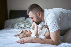 father plays with his daughter photo