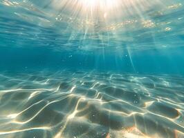 ai generado un hermosa submarino ver de el claro, turquesa Oceano con un arenoso fondo y rayos de luz de sol filtración mediante el agua. el ligero refleja apagado el calma aguas foto