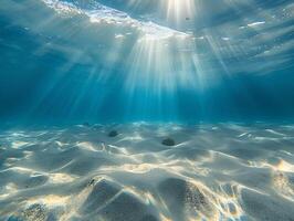 AI generated A beautiful underwater view of the clear, turquoise ocean with a sandy bottom and rays of sunlight filtering through the water. The light reflects off the calm waters photo