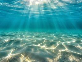 ai generado un hermosa submarino ver de el claro, turquesa Oceano con un arenoso fondo y rayos de luz de sol filtración mediante el agua. el ligero refleja apagado el calma aguas foto