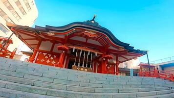 Shinjuku, Tokyo, Japan. Hanazono Shrine, a shrine standing in the middle of the city. It existed in 1590, the year Tokugawa Ieyasu entered Tokyo photo