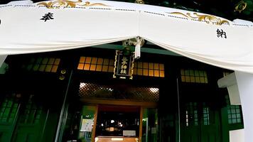 Wooden worship hall of the shrine.Oji Shrine is a shrine located in Oji Honmachi, Kita Ward, Tokyo, Japan. photo