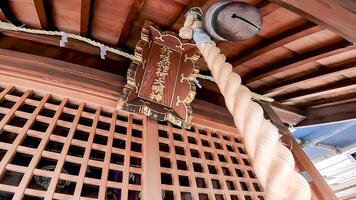 Shrine bell and worship hall.Japan, Osaki Inari Shrine, Namiyoke Inari Shrine, located in Tsukuda, Chuo Ward, Tokyo photo