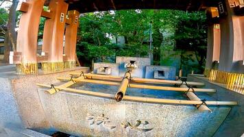 Shrine water fountain spring water.Oji Shrine is a shrine located in Oji Honmachi, Kita Ward, Tokyo, Japan. photo