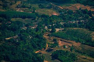 The stunning view in Forest Park from a tourist's standpoint as they go down a hill with background of blue sky, Rainforest, Thailand. Bird's eye view. Aerial view. photo