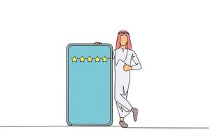 Single continuous line drawing young happy Arabian man stands casually next to a large smartphone, other hand giving a thumbs up gesture. Give review five star. One line design illustration vector