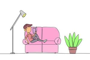 Continuous one line drawing boy sitting stretched out on the sofa reading a book. Really like the content of the book reading on each page. Impressive. Single line draw design illustration vector