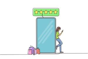 Single continuous line drawing young happy smiling woman leaning on giant smartphone while typing on smartphone. Concept of online shop. Review five gold stars. One line design illustration vector