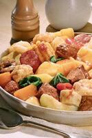 Cozido, classic Brazilian dish with vegetables, legumes and various cooked meats photo