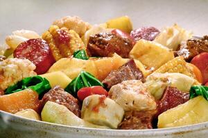 Cozido, classic Brazilian dish with vegetables, legumes and various cooked meats photo