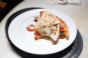 step-by-step guide on how to eat authentic Neapolitan pizza with your hands photo