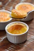 milk pudding on a spoon, traditional Brazilian sweet photo