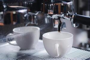 Close-up of a portafilter with a white coffee cup on a coffee machine in a cafe shop. The process of making coffee step by step. Concept of beverages photo
