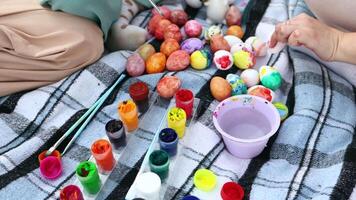 coloring Easter eggs with colorful paints. Religion and traditions. Easter celebration. Process of making handmade painted Easter eggs video