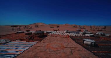 A panoramic sand dune near the desert camp at Mhamid el Ghizlane in Morocco tilt up video