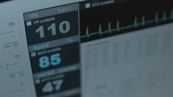 Close-up view of the screen of patient monitor displays vital signs ECG electrocardiogram EKG and oxygen saturation SPO2 video