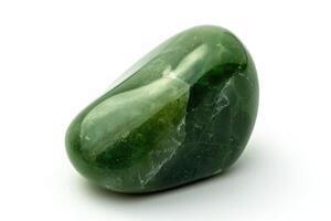 Macro shot of tumbled green Nephrite jade on white background. photo