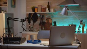 Professional setup for recording podcast in home studio of vlogger. Influencer recording social media content with production microphone. Digital web internet streaming station video
